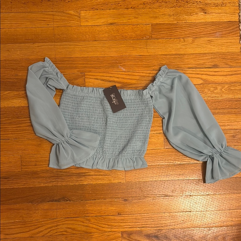 Elegant Blue Off-Shoulder Top by [Brand]